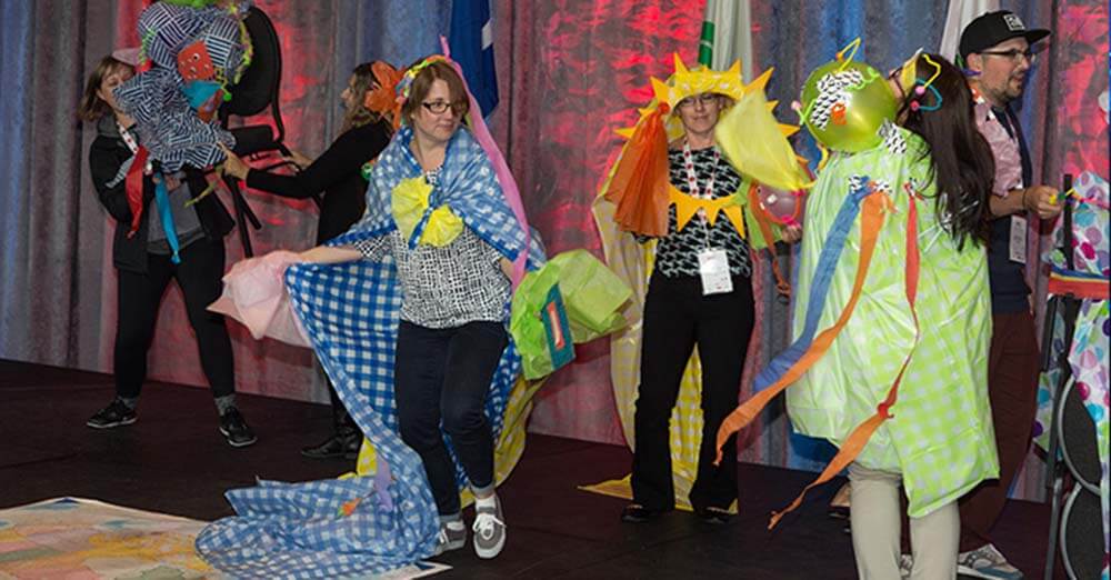 adults playing on a stage