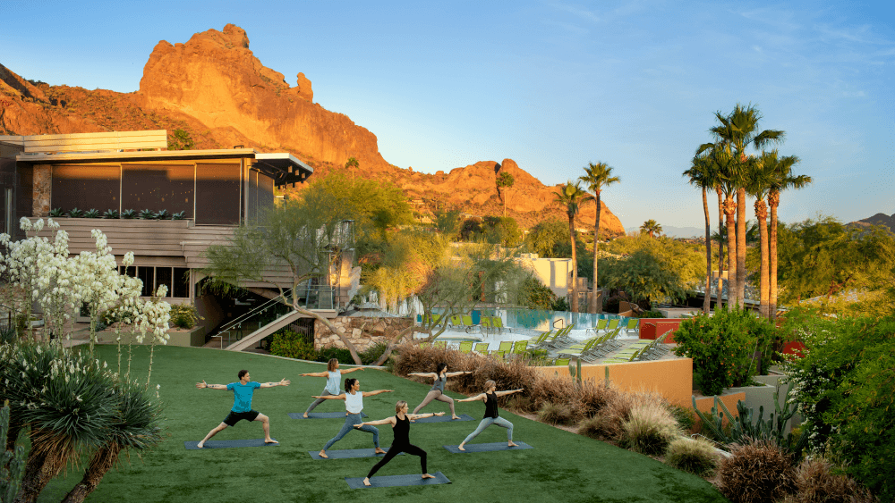 An outdoor yoga class at Sanctuary Camelback Mountain, A Gurney’s Resort & Spa.