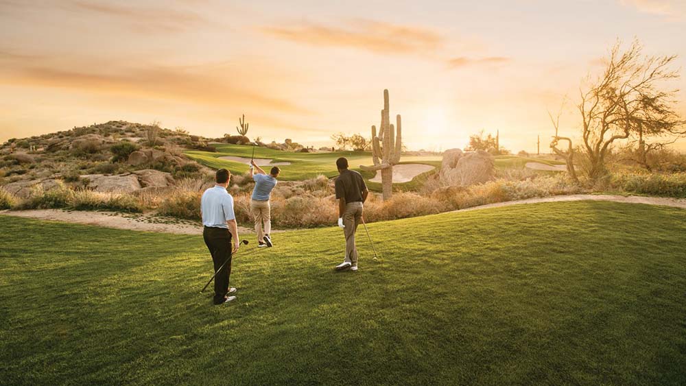 men golfing under desert sun in Scottsdale