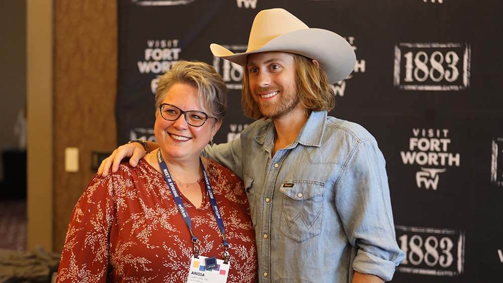 actor Eric Nelsen posing with attendee