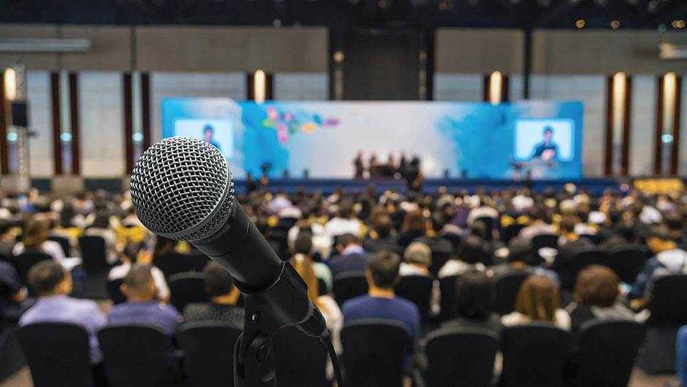 microphone in foreground at conference event