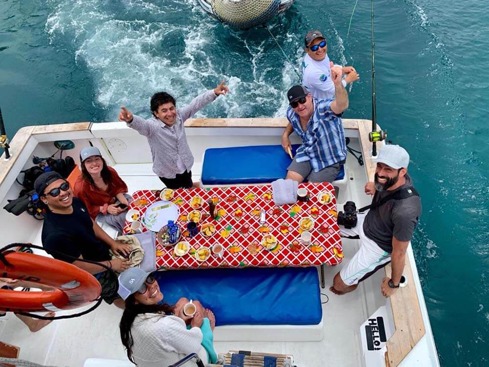 people on boat eating breakfast