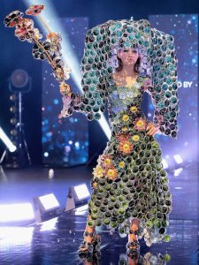 Junk Kouture Finalist in green outfit created from trash