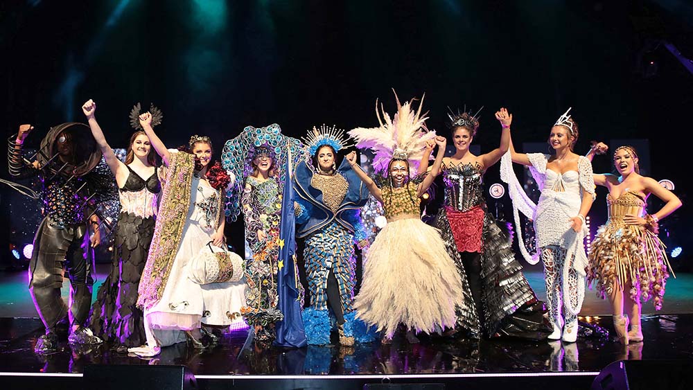 Junk Kouture competitors on stage in outfits made from recycled materials