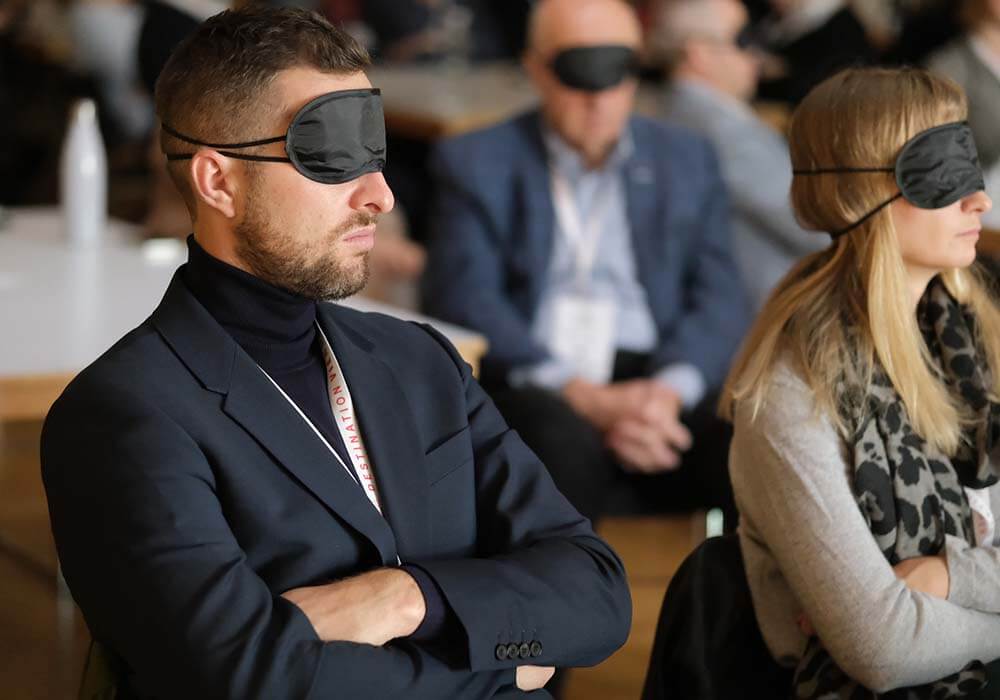people at event wearing eye masks