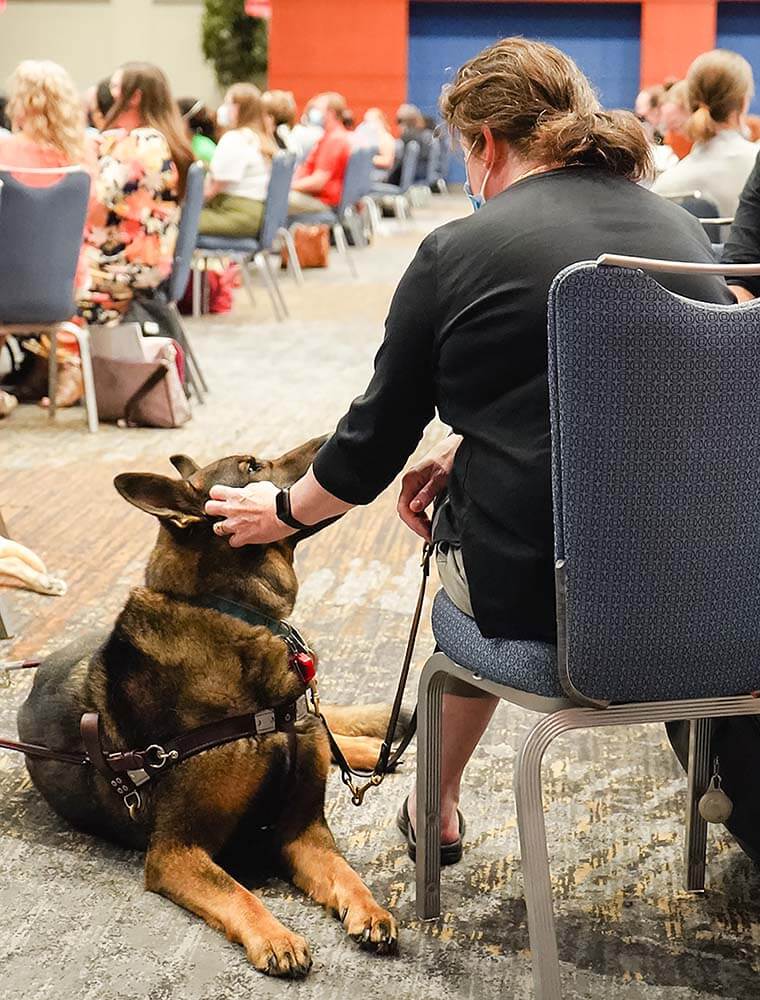 service dog and owner at event