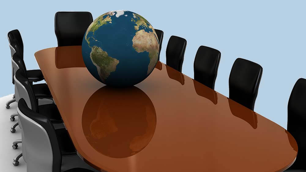 planet Earth sitting on e conference table