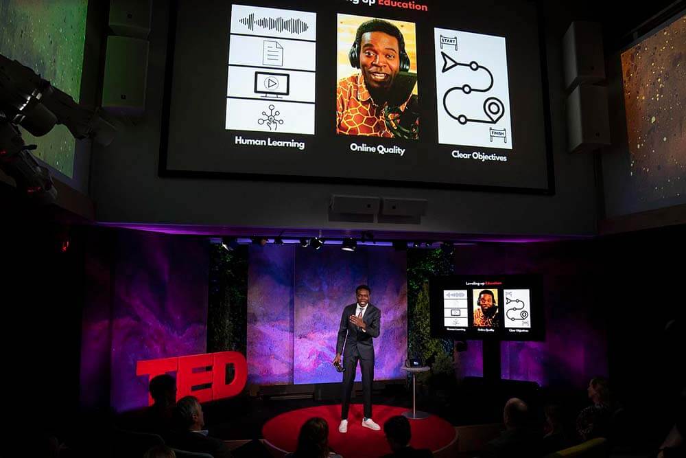video game profession Kris Alexander delivering TED Talk