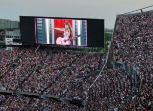 Jumbotron showing Swift performing with guitar