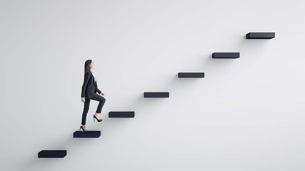 business woman ascending stairs