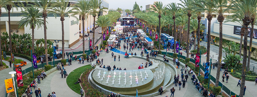 courtyard with a stage set up and lots of people