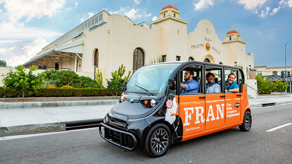 orange mini bus with FRAN on the sire