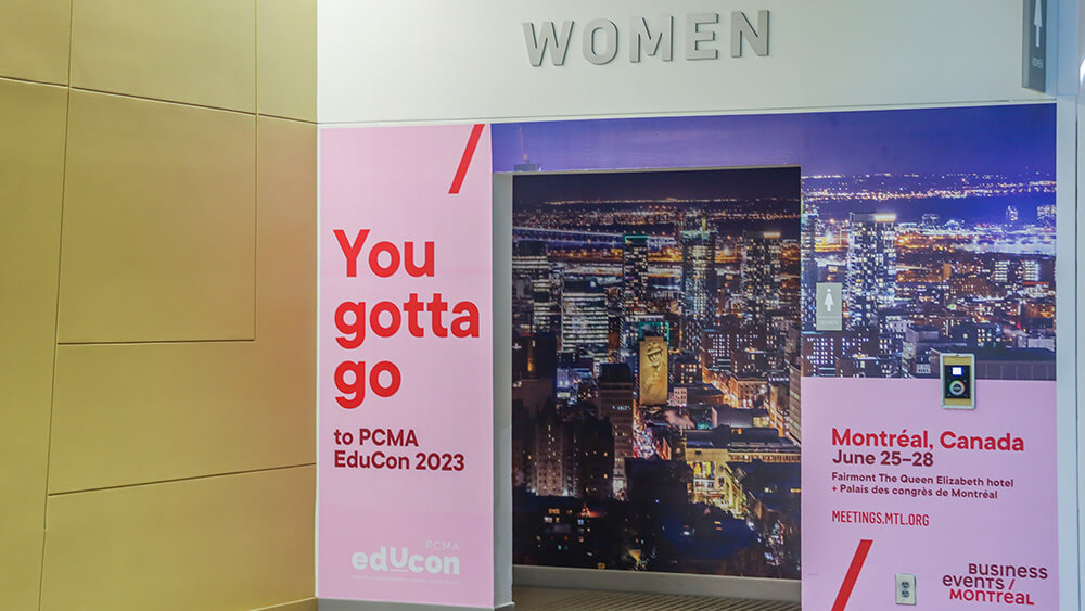 promo on wall near women's restroom with sign saying "you gotta go" to Educon