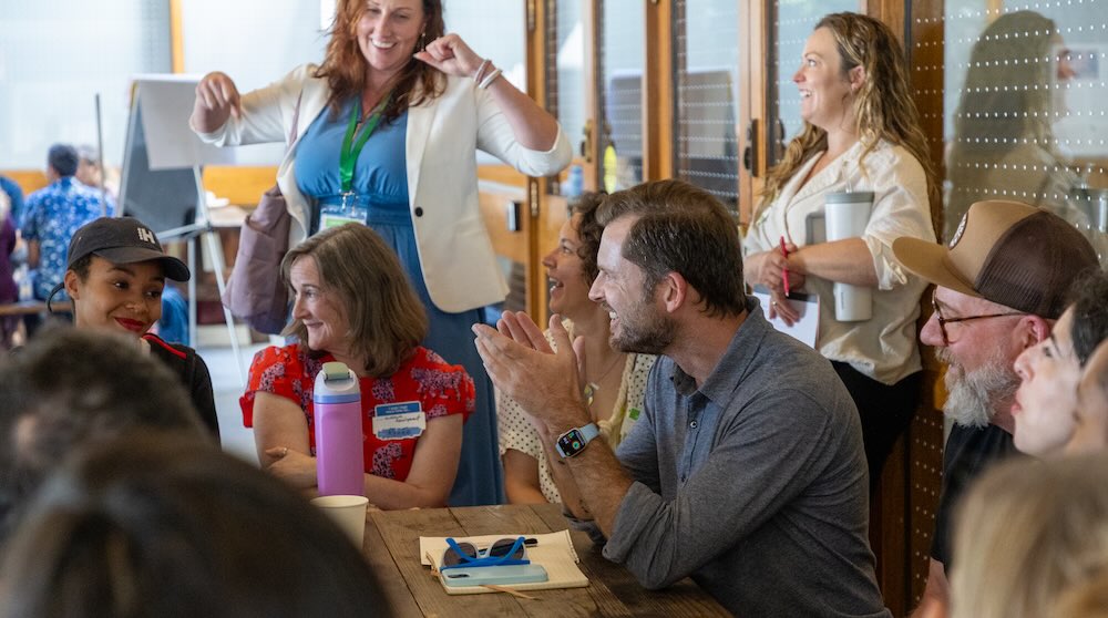 World Domination Summit founder and Main Stage speaker Chris Guillebeau, center, shares ideas in a breakout. Photo by Selina Pan.