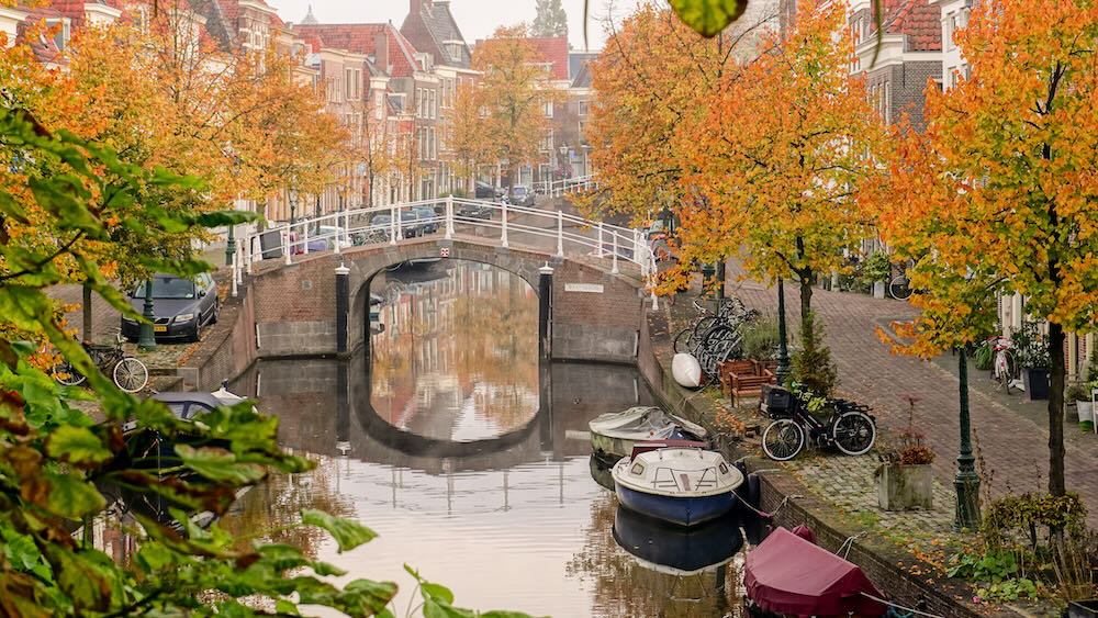 Charming waterways and historic alms-houses are hallmarks of Leiden, the Netherlands.