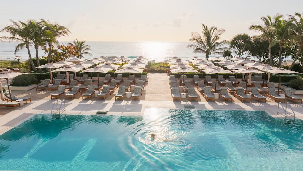 The Four Seasons Resort Palm Beach’s saltwater infinity pool is steps from the shoreline.