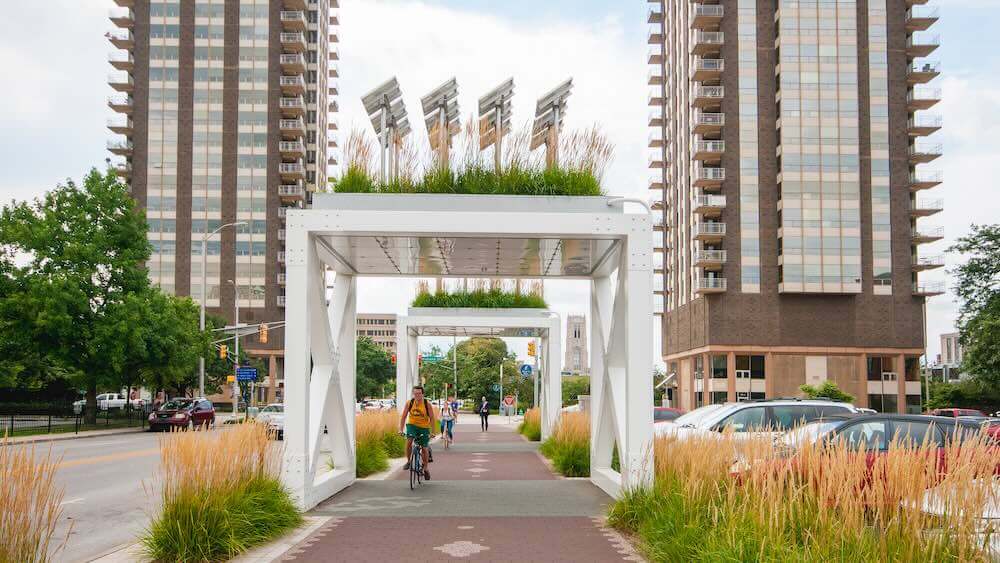 “Prairie Modules 1 & 2” on the Cultural Trail are architectural sculptures with tall grass and solar panels — a reference to the city’s agricultural and urban environment.