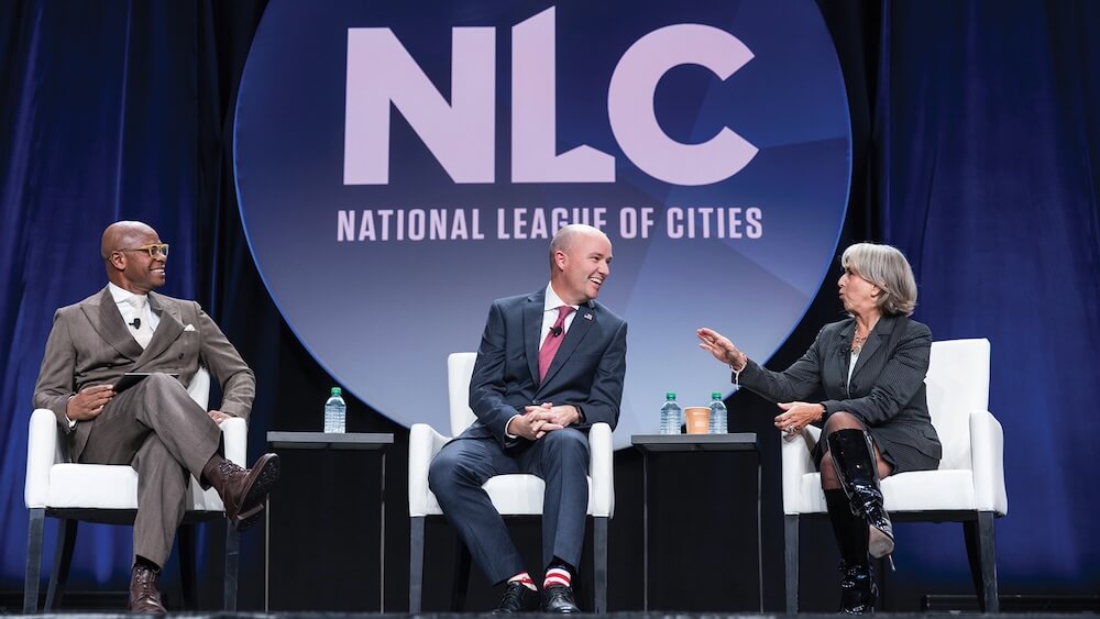 NLC’s Clarence Anthony (left), moderated a conversation between Gov. Spencer Cox and Gov. Lujan Grisham, who talked about — and demonstrated — how to engage in a healthy debate with respect.
