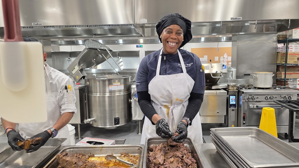 Chef DeeDee shredding beef to reduce portion size. Photo courtesy ReFED.