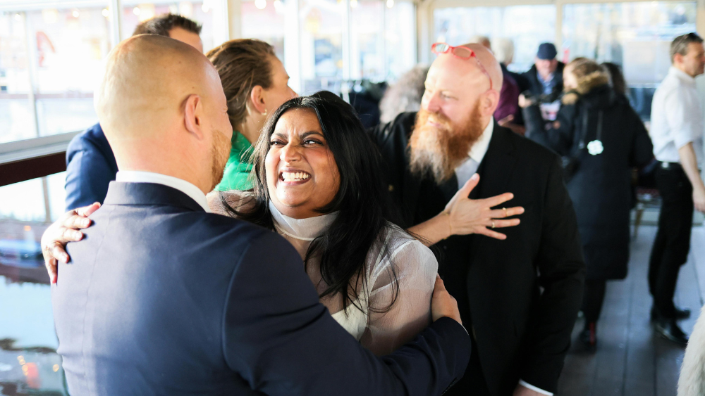 Business acquaintances embracing at a business meeting